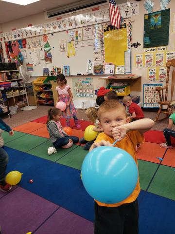 kid with blue balloon 