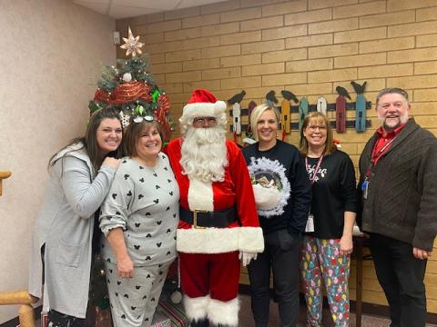 Office staff with Santa