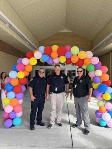 police under balloon arch