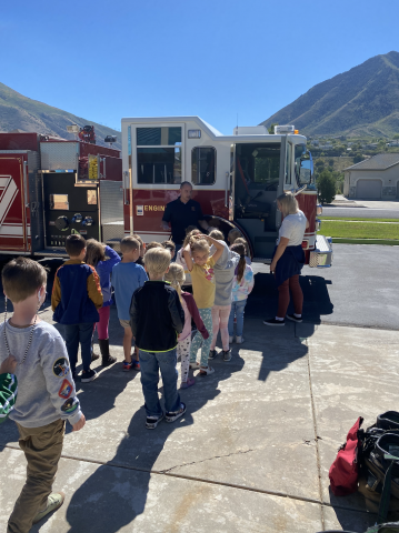 lining up to see the fire truck