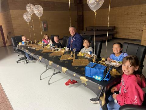 Explorers eating with Mr. Murray