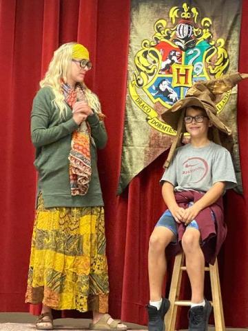 Mrs. Taylor and student wearing sorting hat