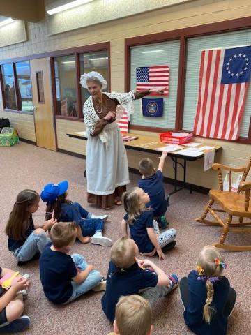 Betsy Ross teaching about the flag