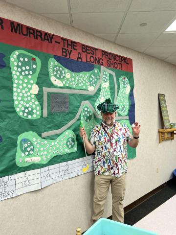 Mr. Murray with poster students and art teacher made him