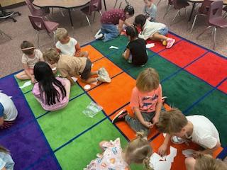 kids on rug playing