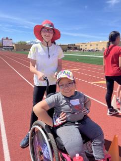student in wheelchair at track meet